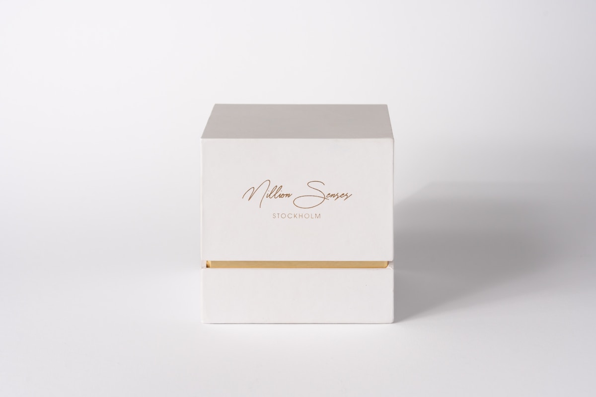 A white box with gold accents on a white background.