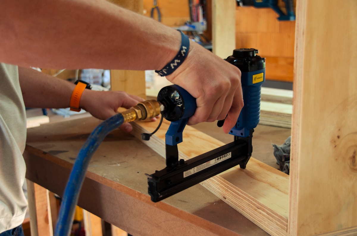 a person using a power drill on a piece of wood